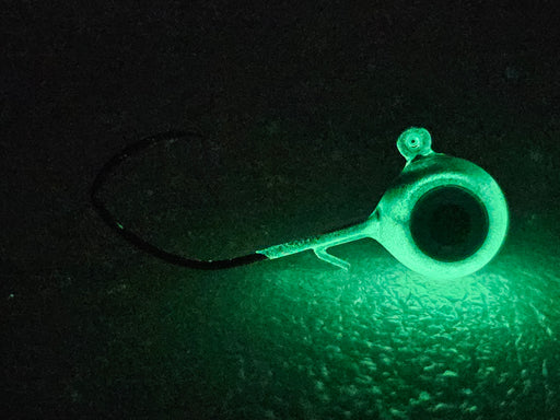 The HCL Silver Shiner Jig is our best multi-species walleye glow jig to date. Its strong green glow is perfect for jigging up walleye on shore. If you're wondering what is the best walleye jig the answer is our Silver Shiner - side view in glow.